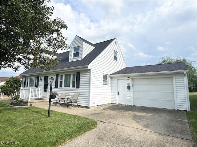 470 Geneva Ave, Struthers, OH 44471 - cape cod-style house featuring concrete driveway, a front yard, a garage, and roof with shingles
