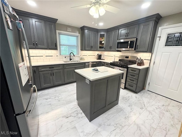 470 Geneva Ave, Struthers, OH 44471 - kitchen with appliances with stainless steel finishes, light marble finish flooring, ceiling fan, backsplash, and recessed lighting