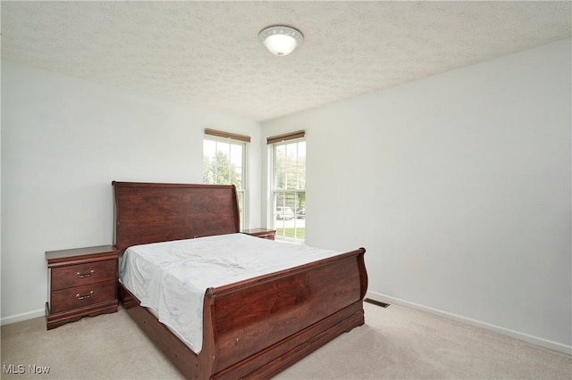 933 Alder Run Way, Akron, OH 44333 - bedroom featuring light carpet and a textured ceiling
