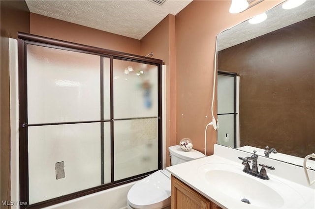 933 Alder Run Way, Akron, OH 44333 - full bath featuring vanity, a textured ceiling, and combined bath / shower with glass door