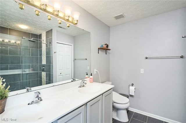 933 Alder Run Way, Akron, OH 44333 - bathroom with double vanity, a stall shower, a textured ceiling, and tile patterned floors