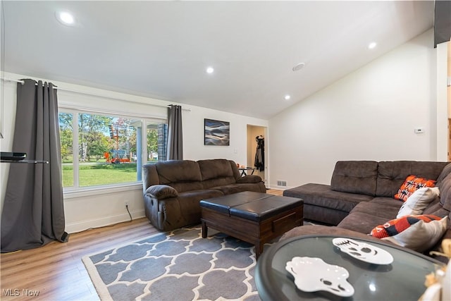 3316 Wadsworth Rd, Norton, OH 44203 - living area with vaulted ceiling, wood finished floors, and recessed lighting