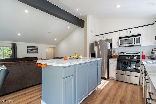 3316 Wadsworth Rd, Norton, OH 44203 - kitchen with appliances with stainless steel finishes, light wood-type flooring, white cabinetry, open floor plan, and recessed lighting