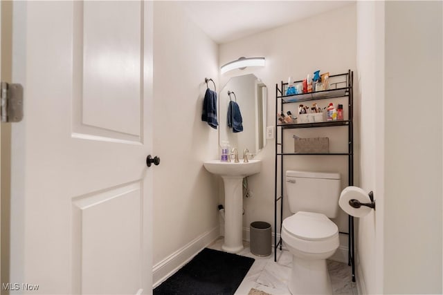 3316 Wadsworth Rd, Norton, OH 44203 - bathroom featuring toilet and marble look tiles