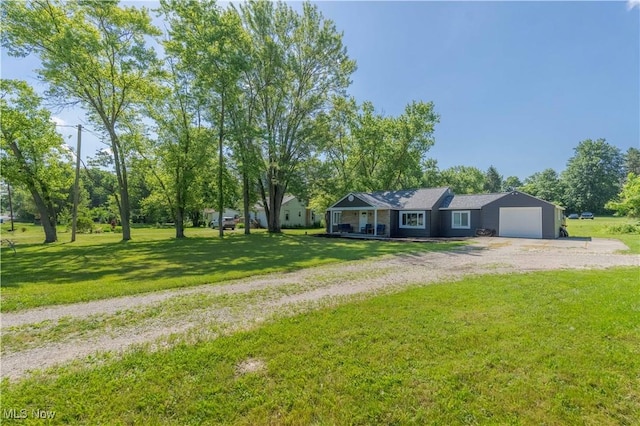 3316 Wadsworth Rd, Norton, OH 44203 - view of front of house featuring driveway, an attached garage, a front lawn, and a porch