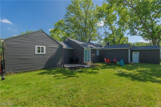 3316 Wadsworth Rd, Norton, OH 44203 - back of property with a yard and entry steps