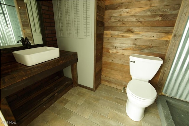 171 W Hiram St, Barberton, OH 44203 - half bathroom with wooden walls and vanity