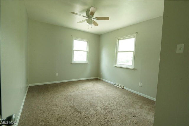 171 W Hiram St, Barberton, OH 44203 - carpeted spare room featuring a ceiling fan and baseboards