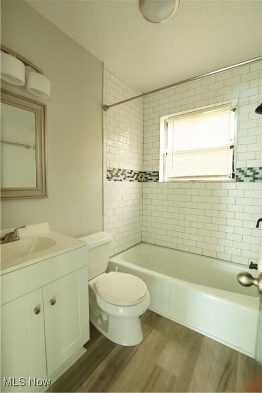 171 W Hiram St, Barberton, OH 44203 - full bathroom with vanity, shower / tub combination, and wood finished floors