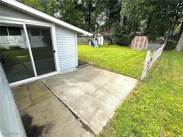 3886 Ascot Ct, Austintown, OH 44511 - view of patio / terrace with a storage unit and view of wooded area