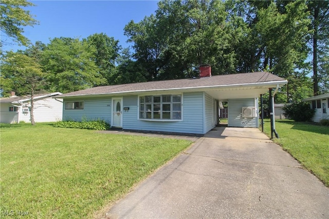 3886 Ascot Ct, Austintown, OH 44511 - view of front of house with concrete driveway, a front lawn, an attached carport, and a chimney