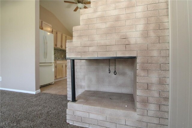 3886 Ascot Ct, Austintown, OH 44511 - detailed view of freestanding refrigerator, ceiling fan, carpet, and tasteful backsplash