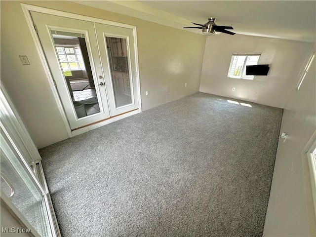3886 Ascot Ct, Austintown, OH 44511 - empty room with french doors, carpet, plenty of natural light, and ceiling fan