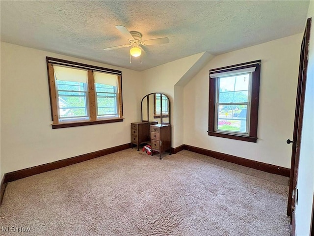 1307 W Ave, Elyria, OH 44035 - empty room with carpet flooring, a textured ceiling, and ceiling fan
