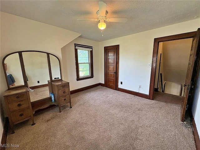 1307 W Ave, Elyria, OH 44035 - unfurnished bedroom featuring carpet, a textured ceiling, and ceiling fan
