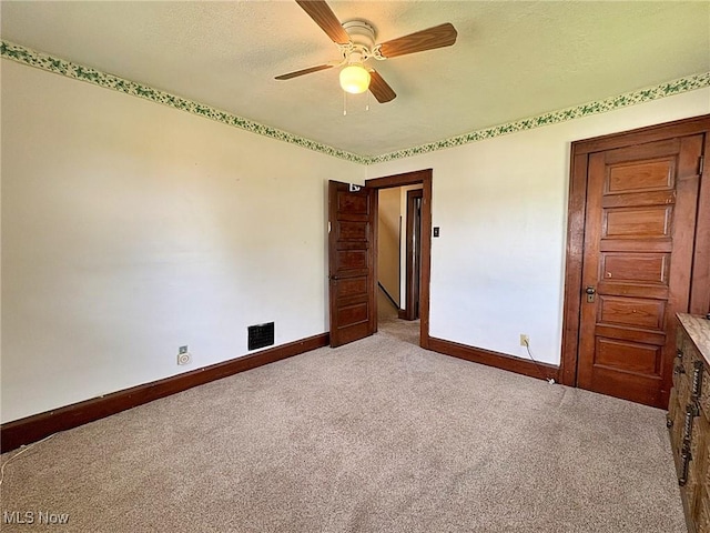 1307 W Ave, Elyria, OH 44035 - unfurnished room with a ceiling fan, carpet floors, and a textured ceiling