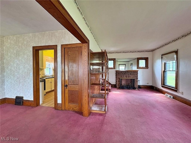 1307 W Ave, Elyria, OH 44035 - living room featuring carpet and a stone fireplace