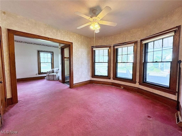 1307 W Ave, Elyria, OH 44035 - spare room featuring dark carpet and ceiling fan