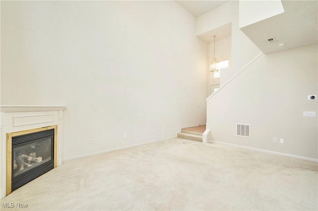 1435 Durham Dr, Broadview Heights, OH 44147 - unfurnished living room with carpet floors, stairway, and a glass covered fireplace