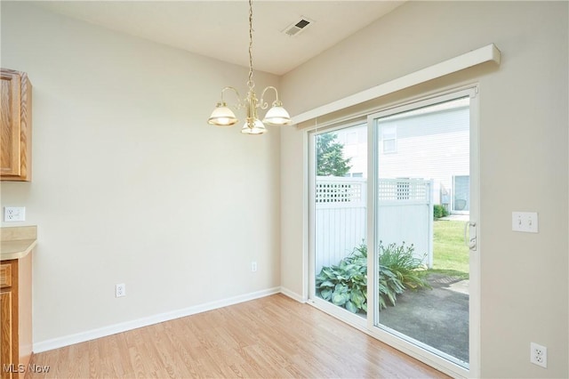 1435 Durham Dr, Broadview Heights, OH 44147 - unfurnished dining area featuring light wood finished floors and a chandelier
