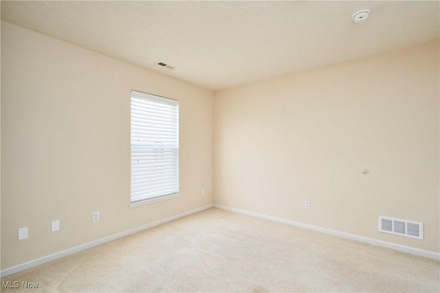 1435 Durham Dr, Broadview Heights, OH 44147 - unfurnished room with light carpet and a smoke detector