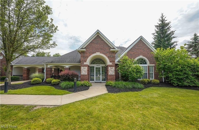 1435 Durham Dr, Broadview Heights, OH 44147 - traditional-style house featuring brick siding and a front lawn