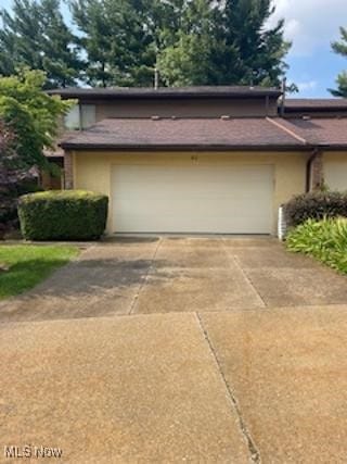 82 Silver Valley Blvd, Munroe Falls, OH 44262 - garage with concrete driveway
