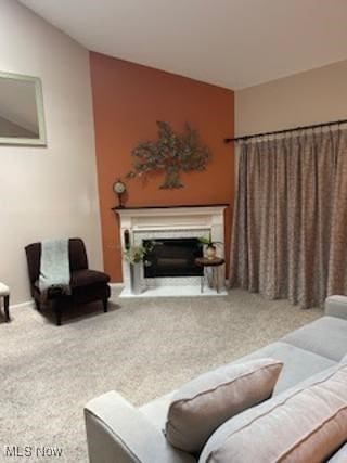 82 Silver Valley Blvd, Munroe Falls, OH 44262 - carpeted living room featuring a glass covered fireplace and vaulted ceiling