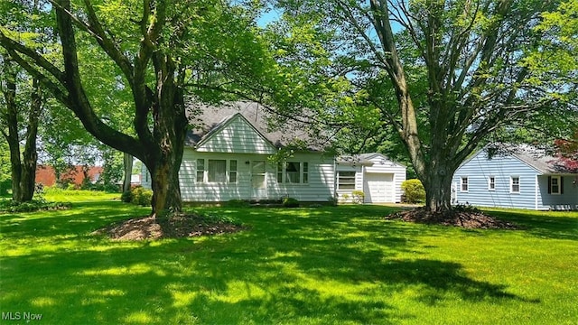 5898 Kellar Rd, New Franklin, OH 44319 - view of front of home featuring an attached garage and a front lawn