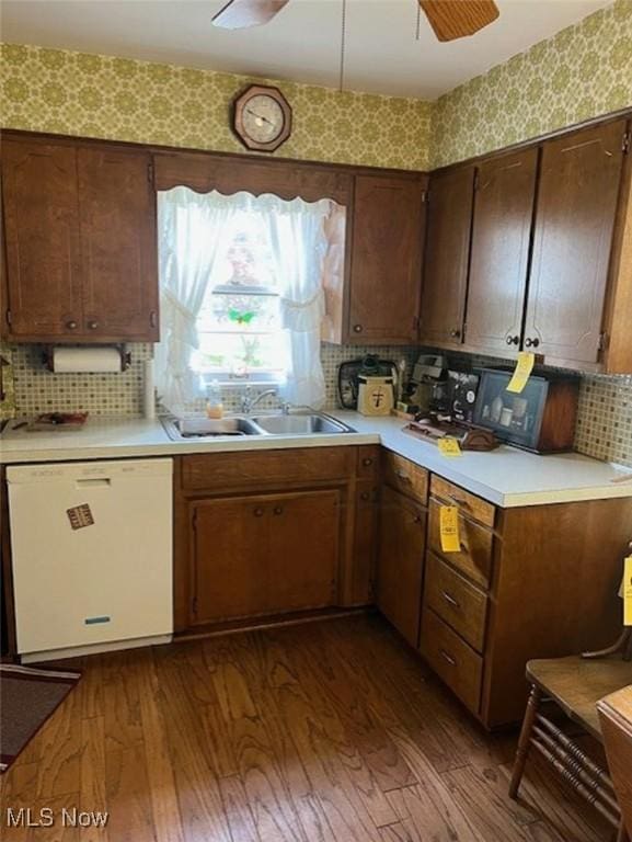 5898 Kellar Rd, New Franklin, OH 44319 - kitchen with white dishwasher, light countertops, decorative backsplash, and dark wood-style floors