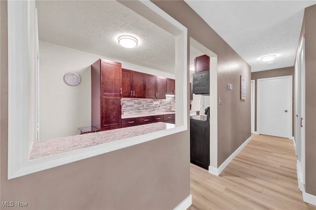 2910 N Bay Dr Unit L11, Westlake, OH 44145 - corridor featuring light wood-style flooring and a textured ceiling