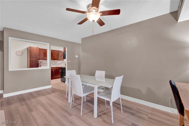 2910 N Bay Dr Unit L11, Westlake, OH 44145 - dining room featuring a ceiling fan, light wood-style flooring, and lofted ceiling