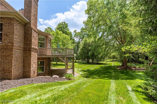 2840 Barclay Cir NW, North Canton, OH 44720 - view of grassy yard with stairs and a deck