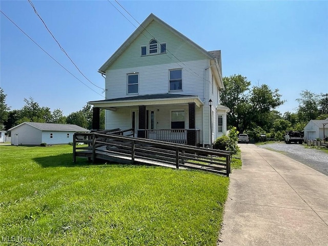 4034 Broadway Ave NE, Louisville, OH 44641 - view of front of home featuring covered porch and a front lawn