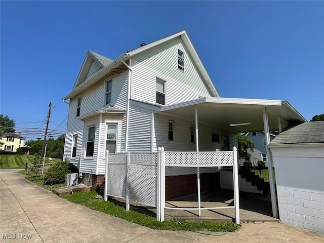 4034 Broadway Ave NE, Louisville, OH 44641 - view of side of home with a central AC unit
