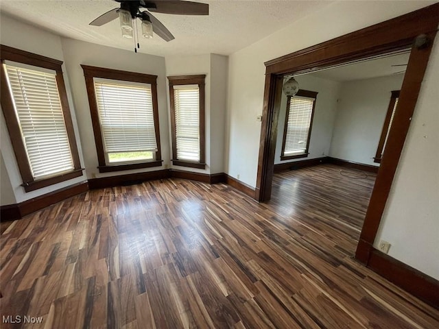 4034 Broadway Ave NE, Louisville, OH 44641 - spare room featuring wood finished floors, a ceiling fan, and a textured ceiling
