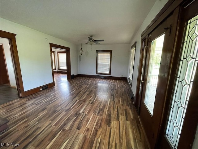4034 Broadway Ave NE, Louisville, OH 44641 - entrance foyer with dark wood-type flooring, healthy amount of natural light, and a ceiling fan