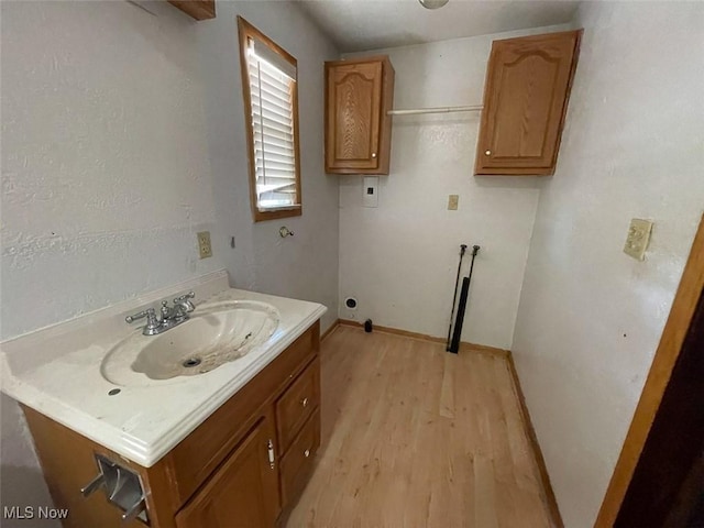 4034 Broadway Ave NE, Louisville, OH 44641 - bathroom with wood finished floors and vanity