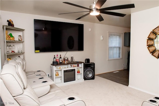 1863 Deerfield Ave SW, Warren, OH 44485 - carpeted living room with a ceiling fan