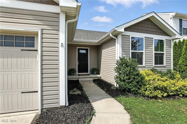 107 Lakeview Cir, Amherst, OH 44001 - entrance to property featuring roof with shingles and a garage