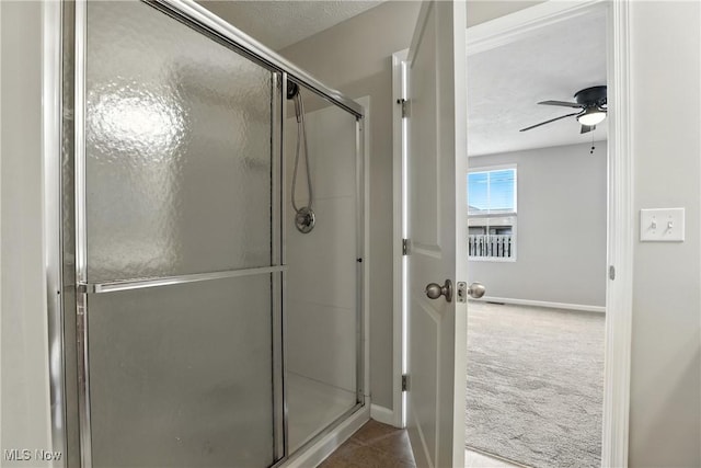 107 Lakeview Cir, Amherst, OH 44001 - bathroom with a stall shower and a ceiling fan