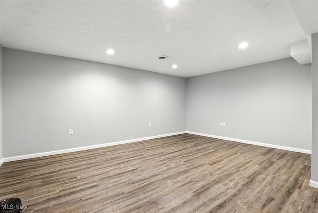 107 Lakeview Cir, Amherst, OH 44001 - unfurnished room with wood finished floors and recessed lighting