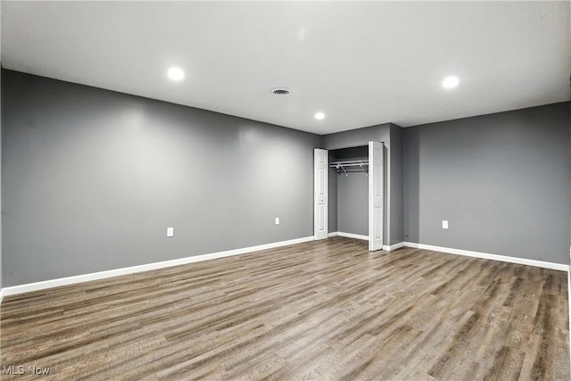 107 Lakeview Cir, Amherst, OH 44001 - unfurnished bedroom with recessed lighting, wood finished floors, and a closet