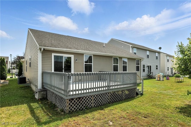 107 Lakeview Cir, Amherst, OH 44001 - back of property with a yard, roof with shingles, and a wooden deck