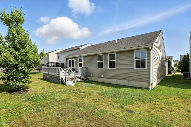 107 Lakeview Cir, Amherst, OH 44001 - back of property with a deck, a lawn, a gazebo, and a shingled roof