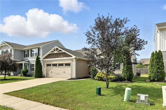 107 Lakeview Cir, Amherst, OH 44001 - view of front of house featuring a garage, driveway, and a front yard