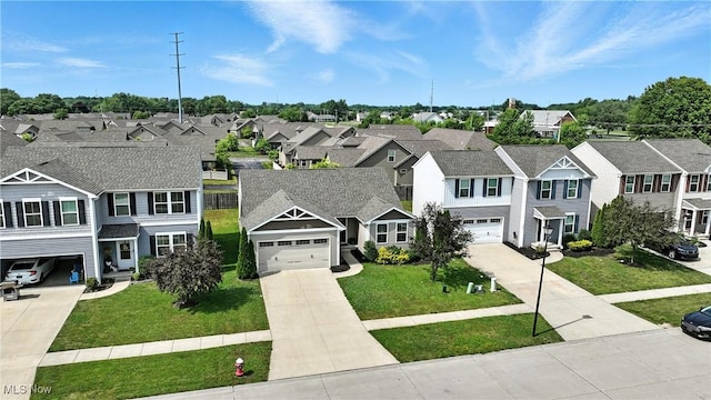 107 Lakeview Cir, Amherst, OH 44001 - view of front of house with a residential view, driveway, a garage, and a front lawn