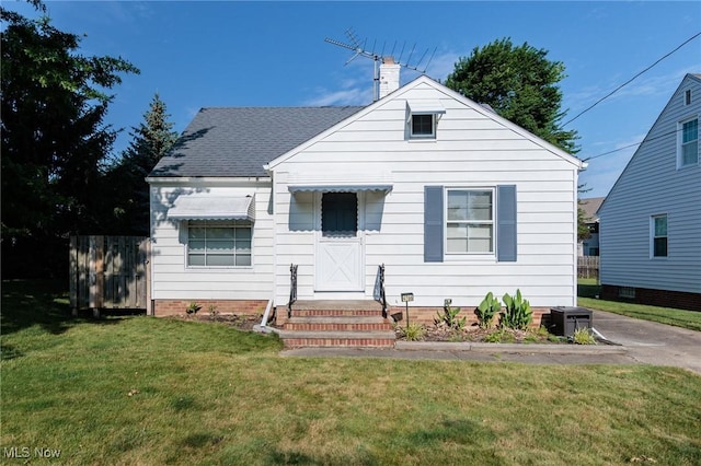 4766 Brookwood Dr, Brooklyn, OH 44144 - bungalow-style house featuring a front lawn, a chimney, and roof with shingles