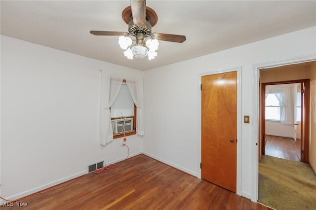 4766 Brookwood Dr, Brooklyn, OH 44144 - unfurnished bedroom with cooling unit, wood finished floors, and ceiling fan