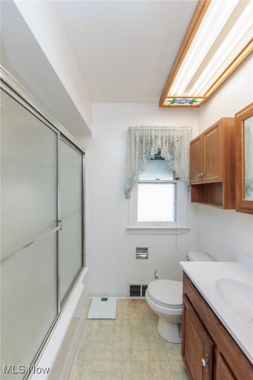 4766 Brookwood Dr, Brooklyn, OH 44144 - full bathroom featuring vanity and enclosed tub / shower combo